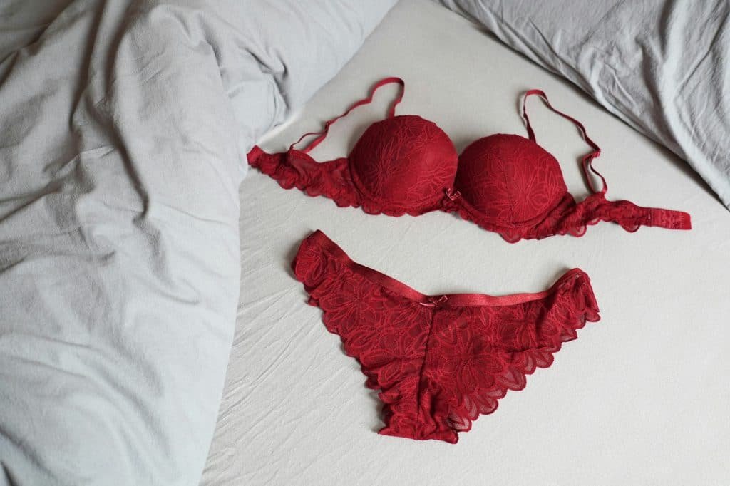 red bra and panty lingerie set on bed